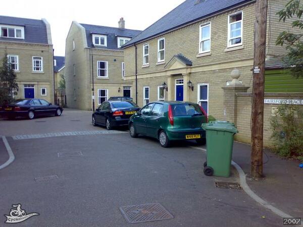 The photo for Fairsford Place - lack of cycle parking.